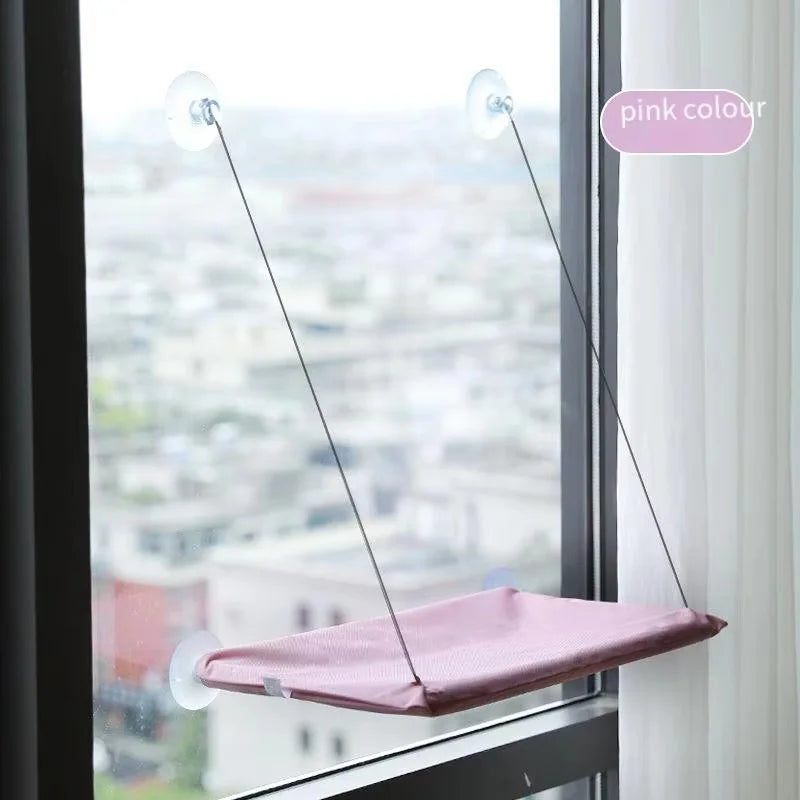 The hammock in purple, mounted on a window