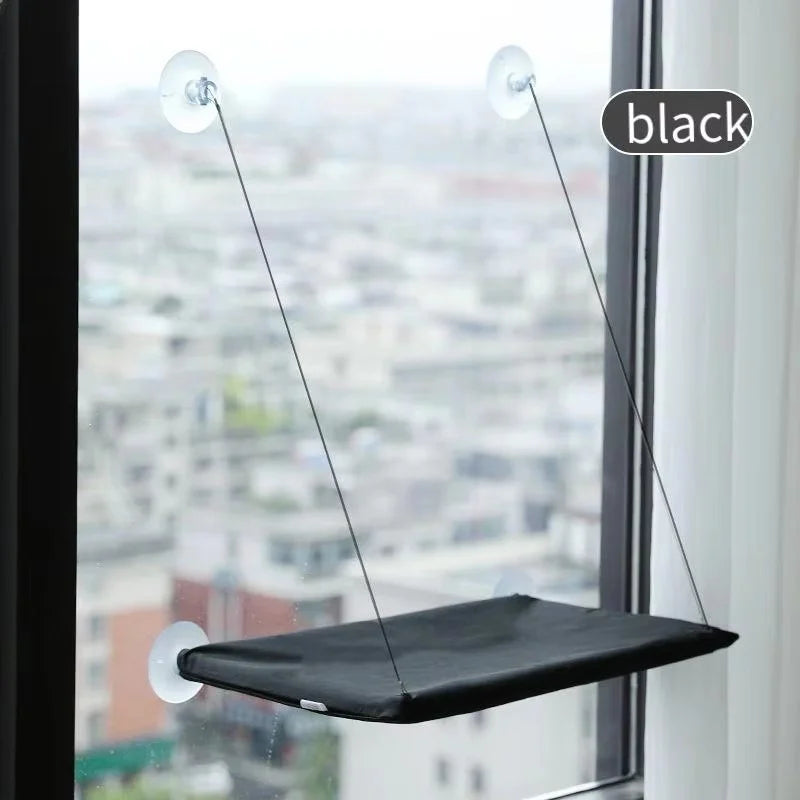 The hammock in black, mounted on a window