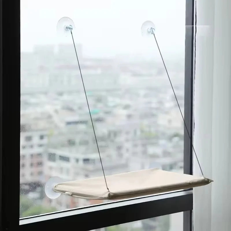 The hammock mounted on a window, seen from the side