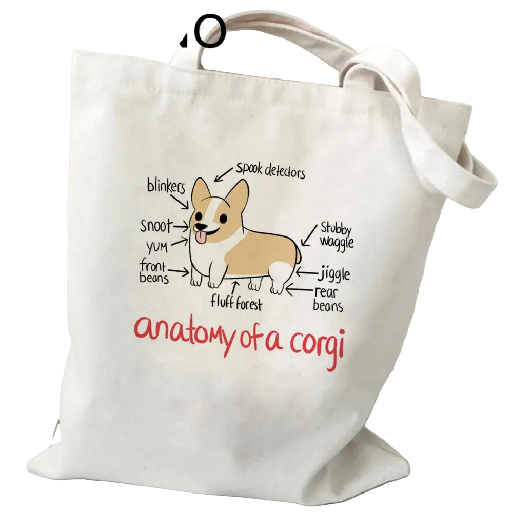 Cream canvas tote bag featuring a humorous Anatomy of a Corgi illustration with labelled body features