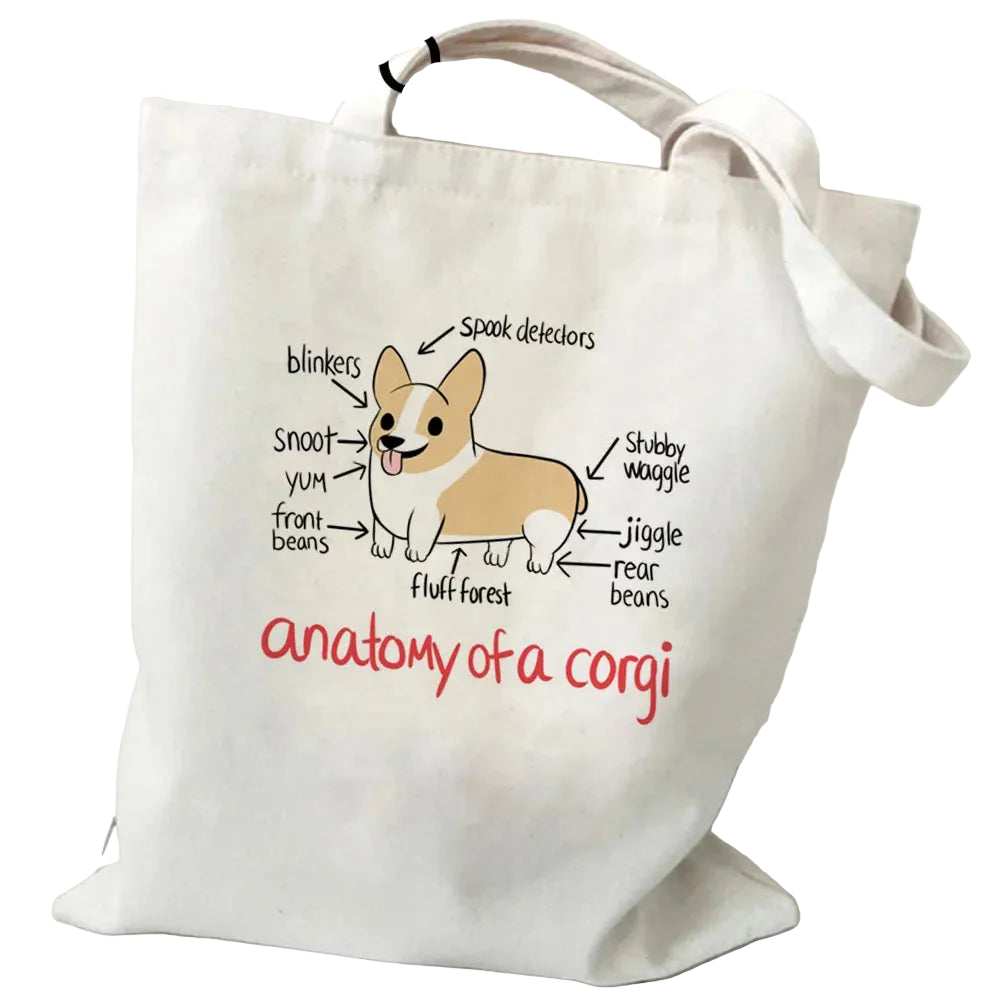Cream canvas tote bag featuring a humorous Anatomy of a Corgi illustration with labelled Corgi body features