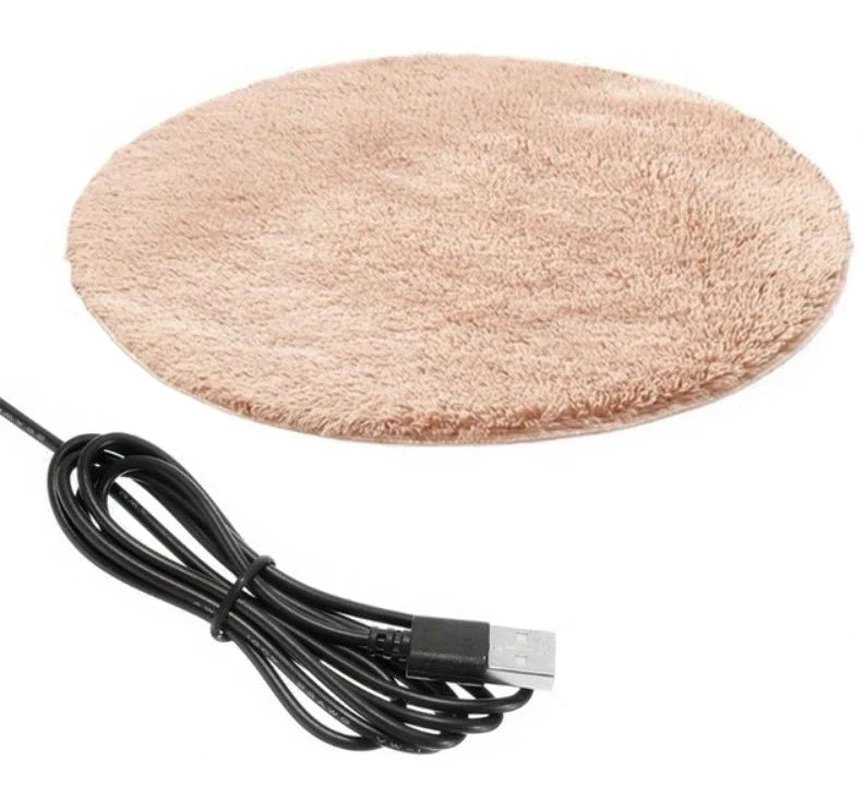 Beige round USB heated pet mat with soft plush cover and attached power cable