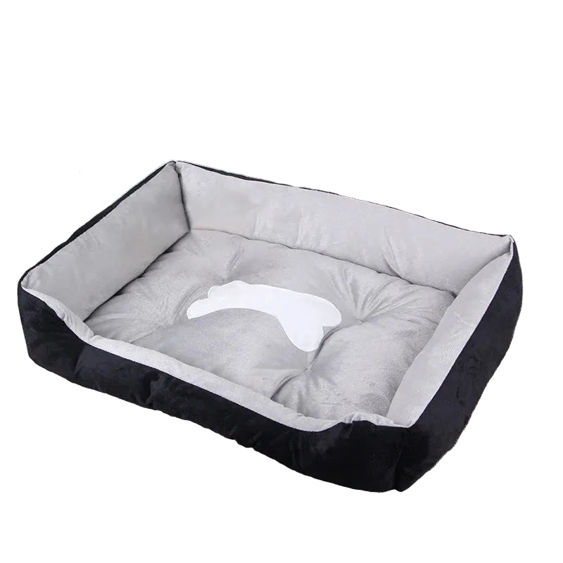 Black and grey bolster dog bed with soft plush lining, raised cushioned sides and bone-shaped centre detail