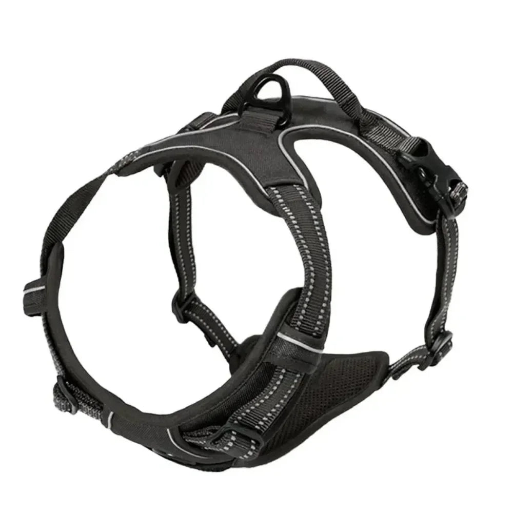 Black padded adjustable dog harness with reflective stitching, grab handle and leash attachment ring shown from the side