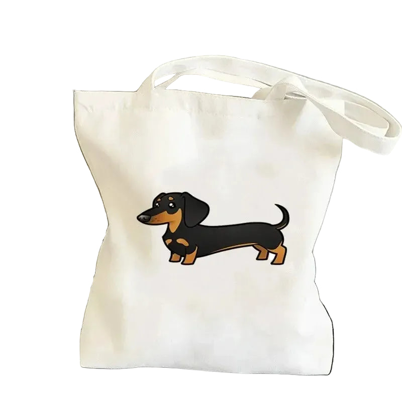 Cream canvas tote bag featuring a black and tan cartoon Dachshund illustration