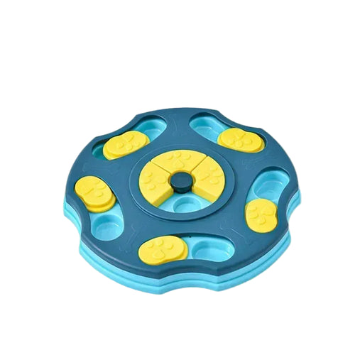 Blue round interactive dog puzzle feeder with yellow sliding treat covers and a red bone-shaped centre spinner