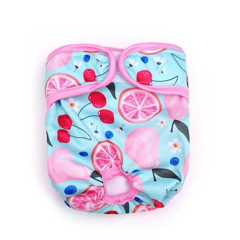 Blue reusable female dog diaper with cherry and citrus fruit print, tail hole and adjustable hook-and-loop fastening