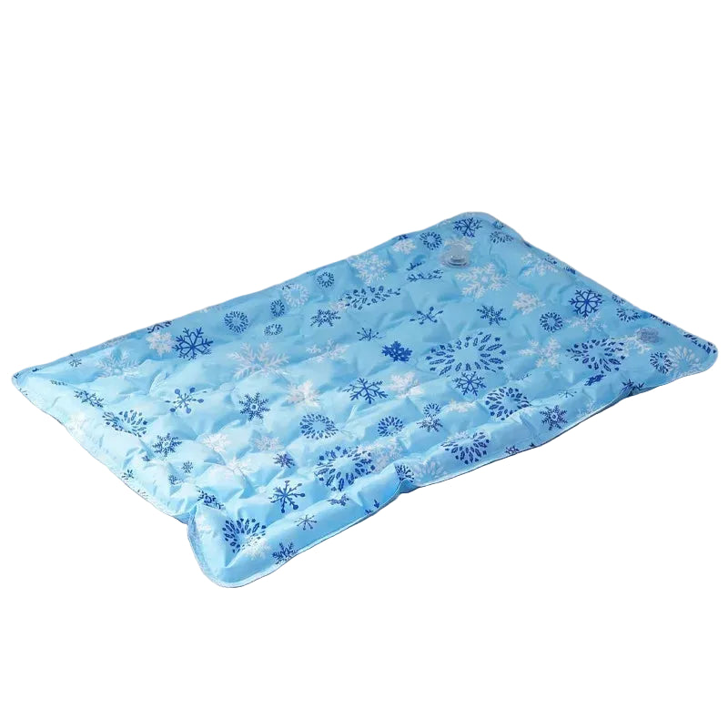 Blue quilted pet cooling mat with snowflake print, shown from an angled view