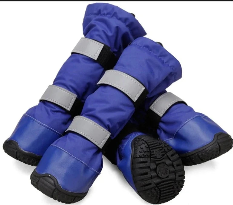 Set of four blue waterproof dog boots with reflective straps and textured non-slip rubber soles