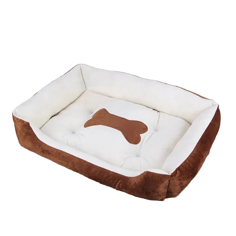 Brown and cream bolster dog bed with soft padded base, raised cushioned sides and bone-shaped centre detail
