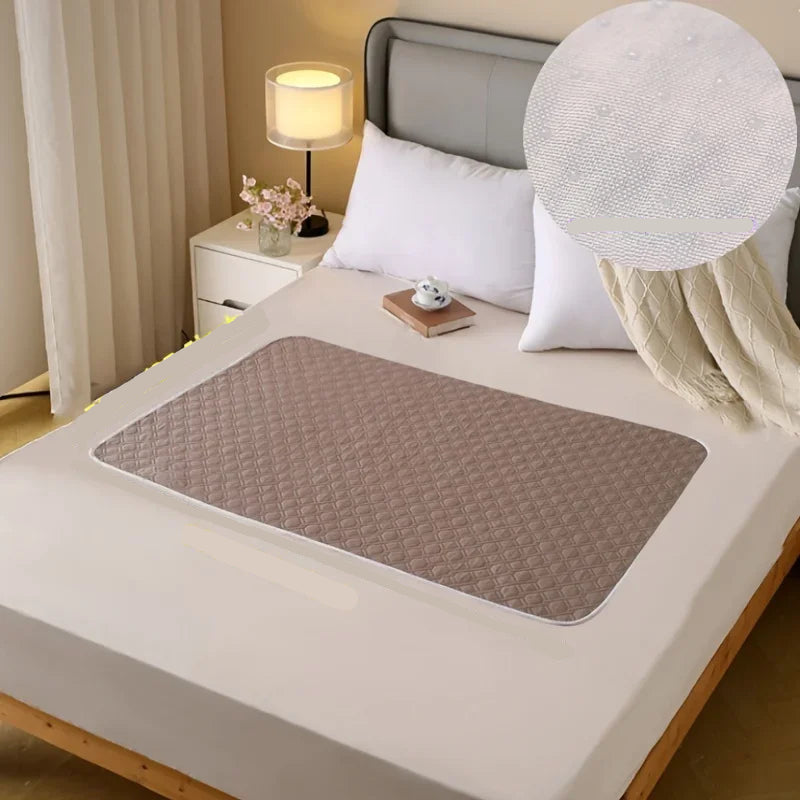 Brown quilted dog bed mat with padded diamond-pattern surface placed across a bedroom bed