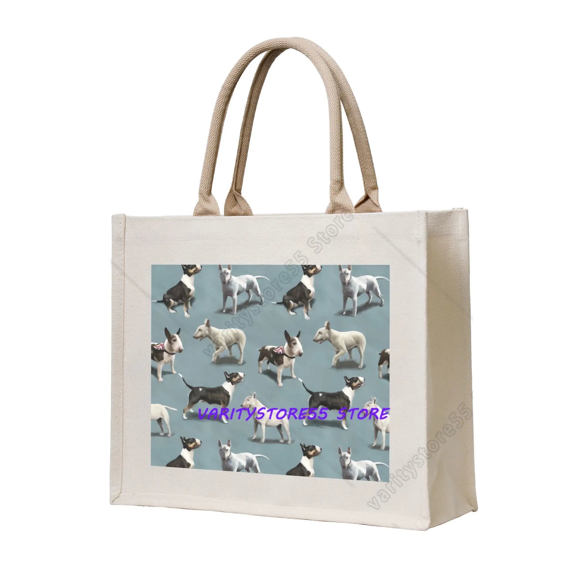 Cream canvas tote bag featuring a repeating pattern of Bull Terrier dogs on a muted blue background
