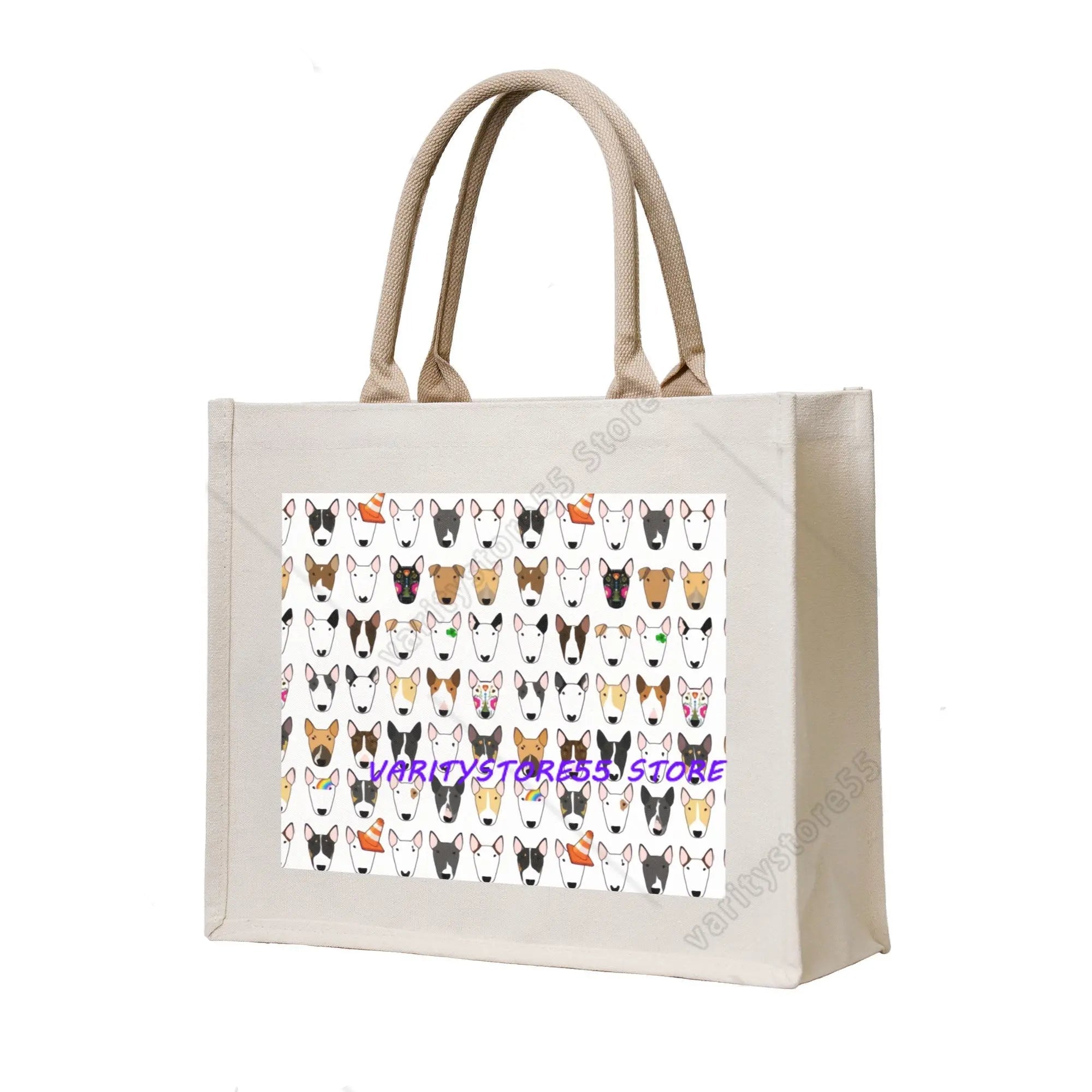 Cream canvas tote bag featuring a repeating pattern of Bull Terrier faces in assorted colours and markings
