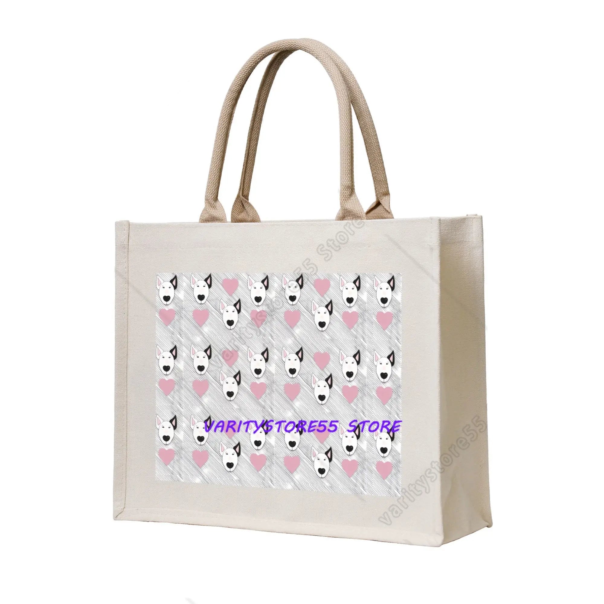 Cream canvas tote bag featuring a repeating Bull Terrier face and pink heart pattern