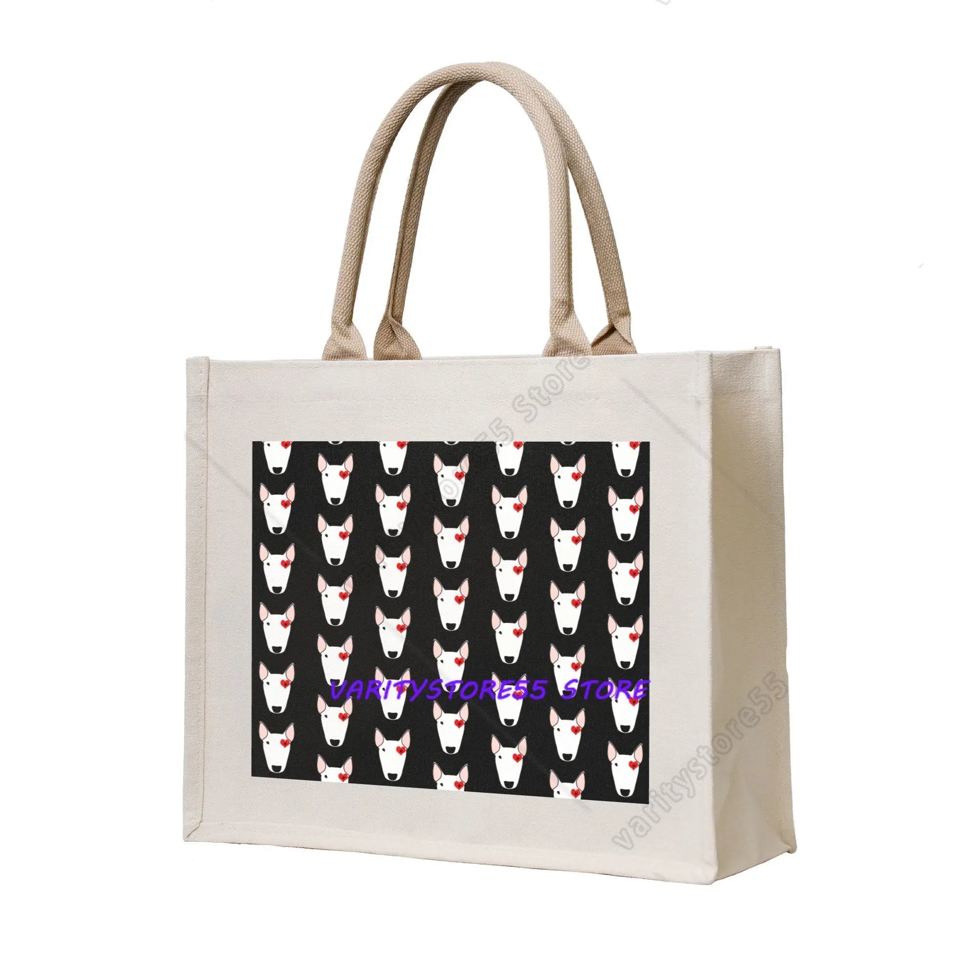 Cream canvas tote bag featuring a repeating white Bull Terrier face pattern with red heart details on a black background