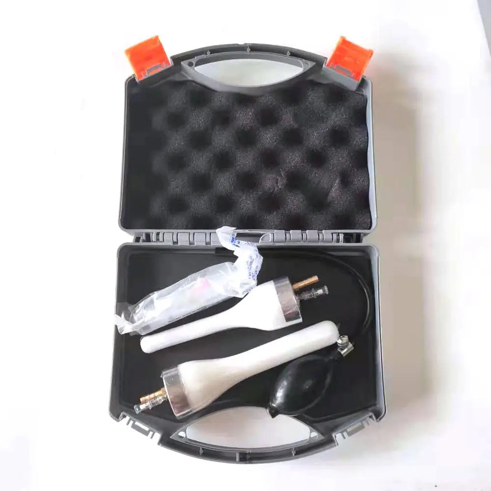 Canine artificial insemination kit with two white catheters, inflation bulb and accessories stored in a protective carry case