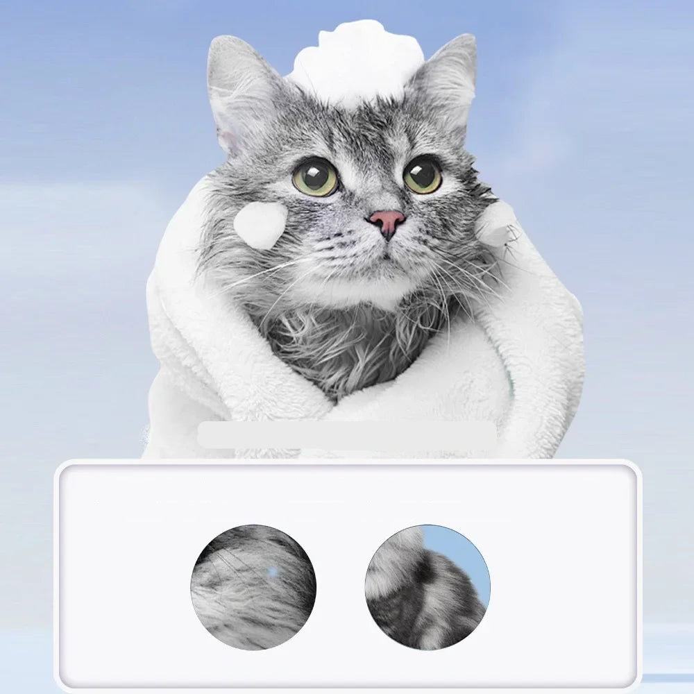 Grey cat wrapped in a towel with shampoo foam, showing pet coat cleansing and grooming care