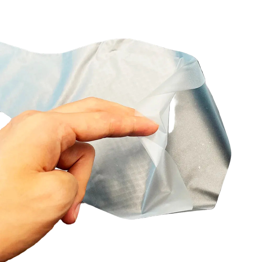 Close-up of a clear canine semen collection bag showing its thin flexible material held between fingers