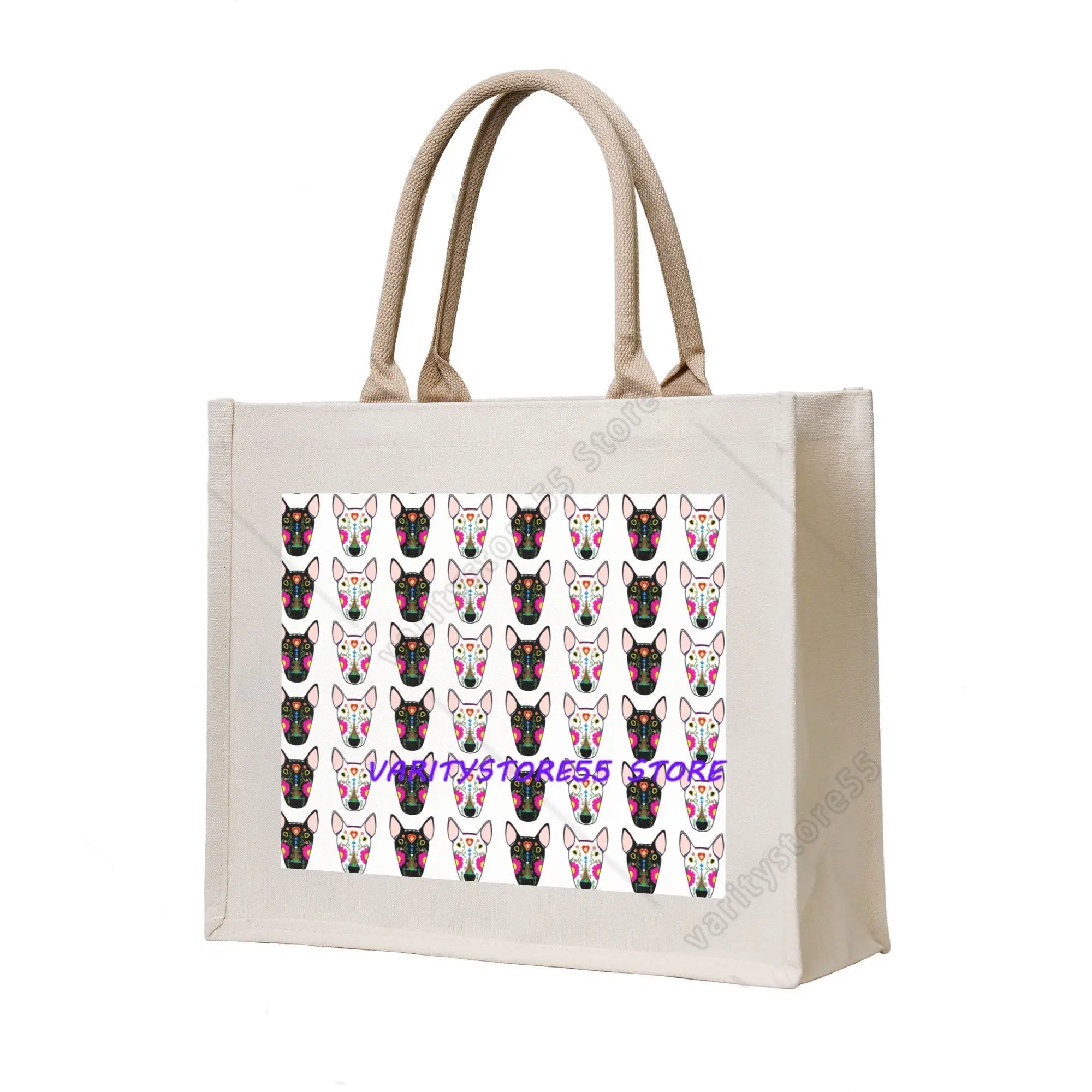 Cream canvas tote bag featuring a repeating pattern of colourful Bull Terrier faces in black and white