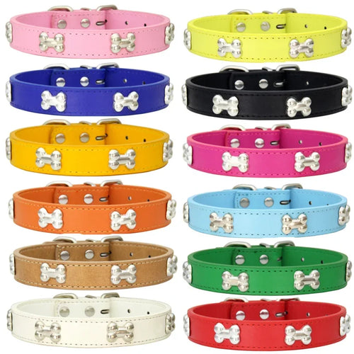 Colourful dog collars in pink, yellow, blue, black, orange, green, red and other colours with silver bone-shaped studs