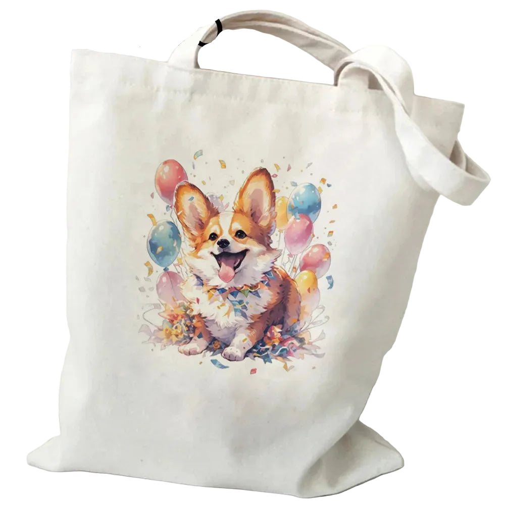 Cream canvas tote bag featuring a happy Corgi surrounded by colourful balloons and confetti