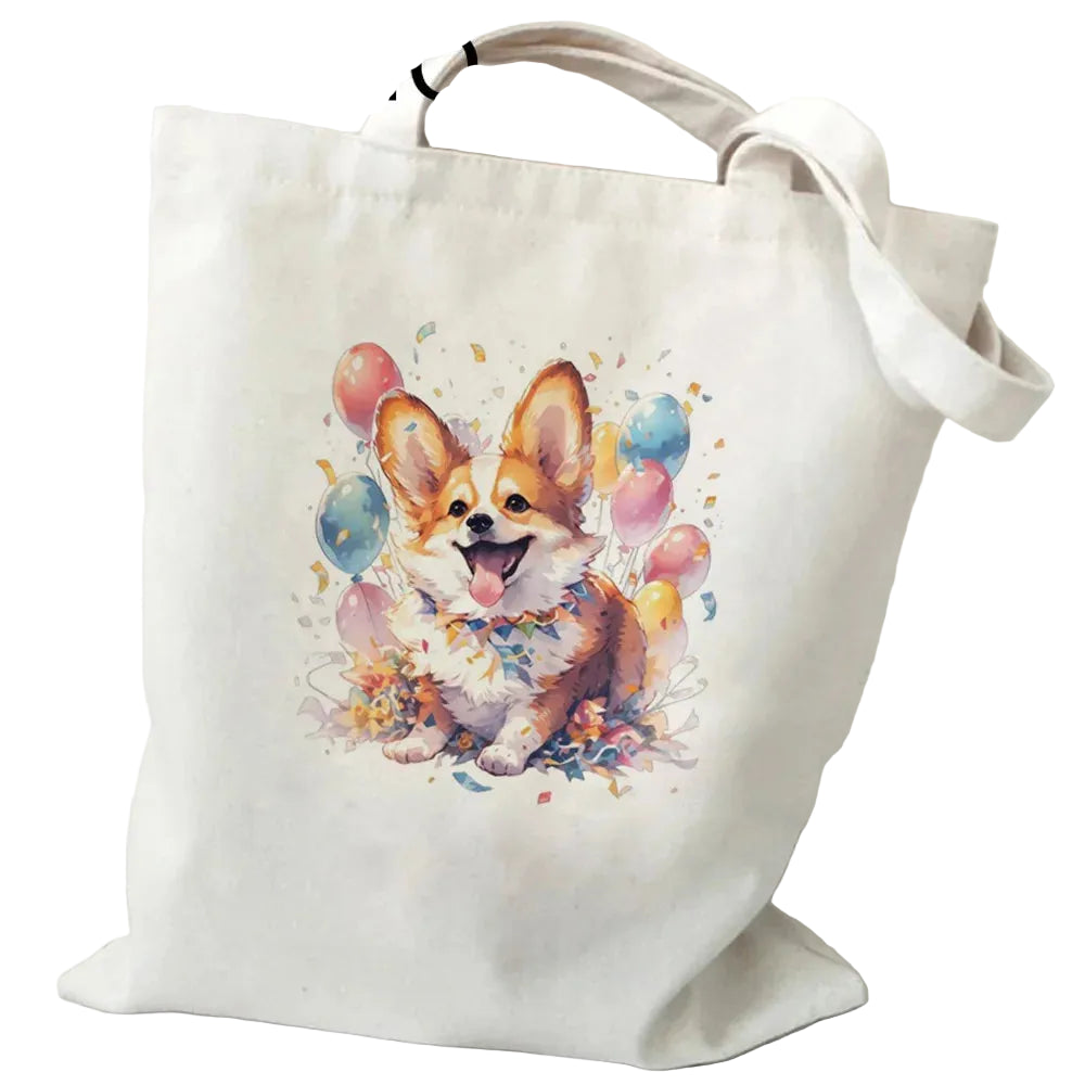 Cream canvas tote bag featuring a happy Corgi surrounded by colourful balloons and confetti
