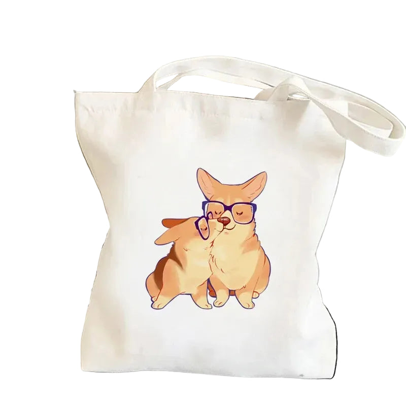 Cream canvas tote bag featuring two cartoon Corgis sharing a kiss, with one wearing purple glasses