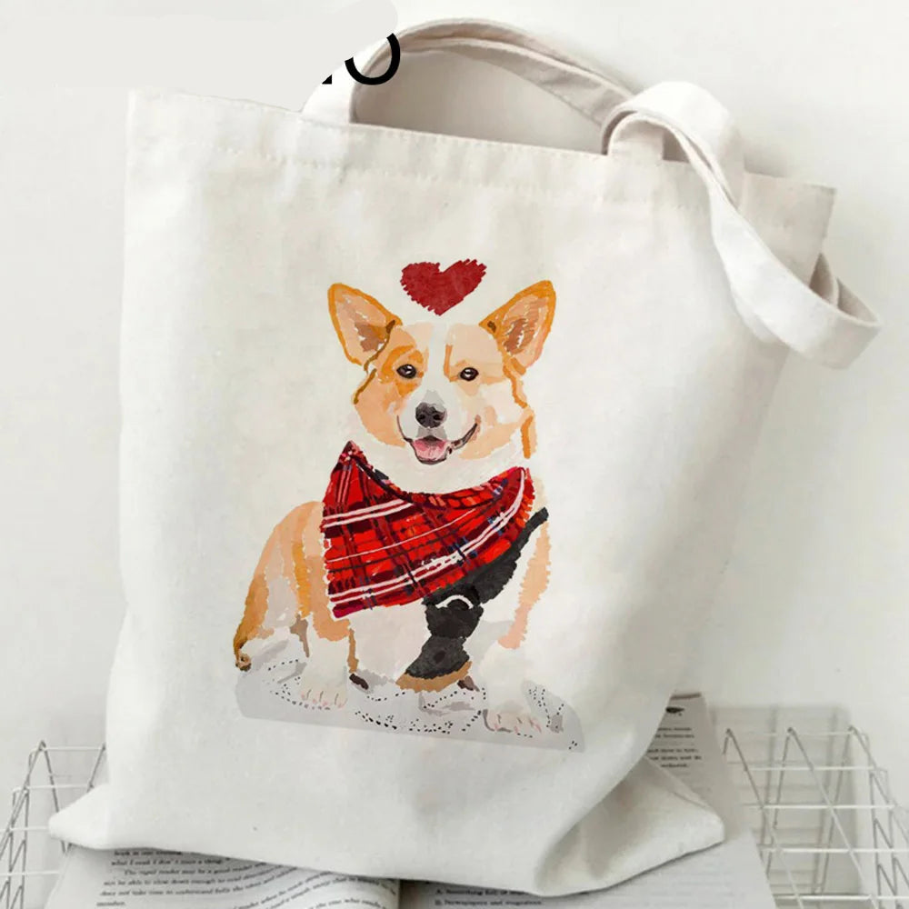 Cream canvas tote bag featuring a Corgi wearing a red plaid scarf with a red heart above its head