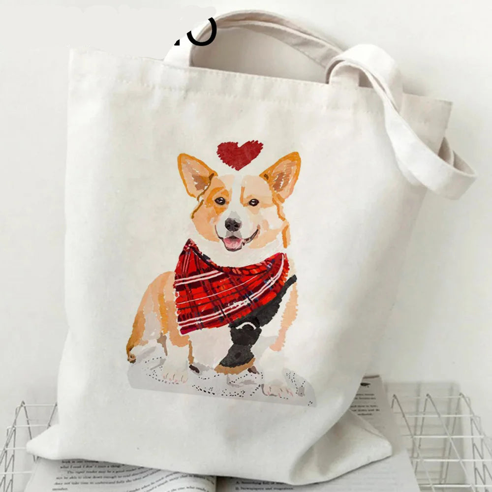 Cream canvas tote bag featuring a Corgi wearing a red tartan scarf with a red heart above its head