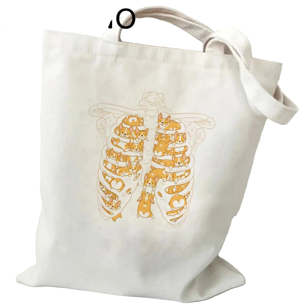 Cream canvas tote bag featuring a ribcage illustration filled with playful Corgis
