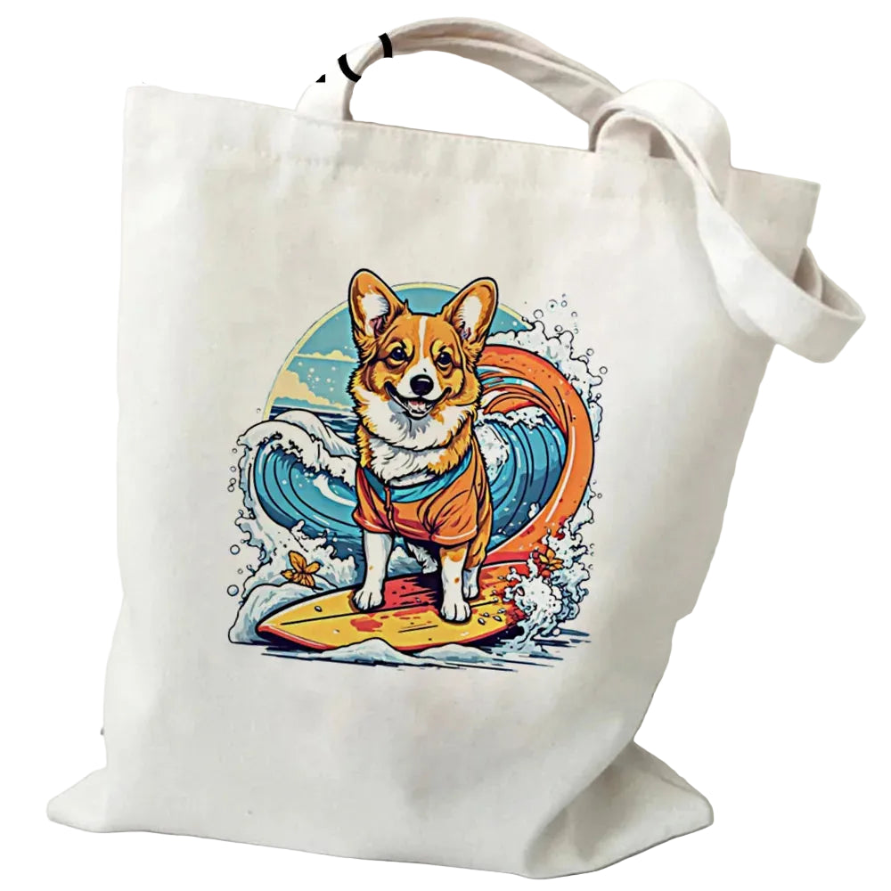 Cream canvas tote bag featuring a Corgi standing on a surfboard with a colourful ocean wave illustration