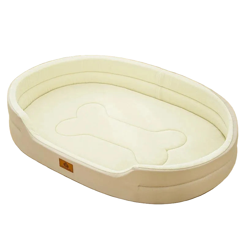 Cream oval dog bed with raised padded sides, low front entry and a bone-shaped cushion design