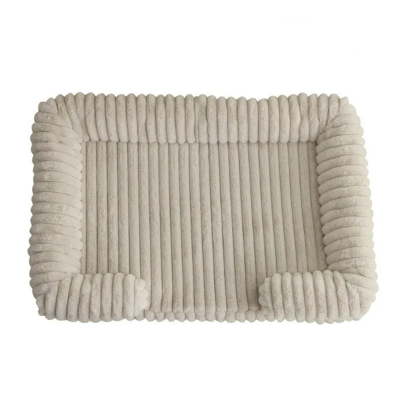 Cream ribbed dog bed mat with soft padded surface and raised cushioned sides