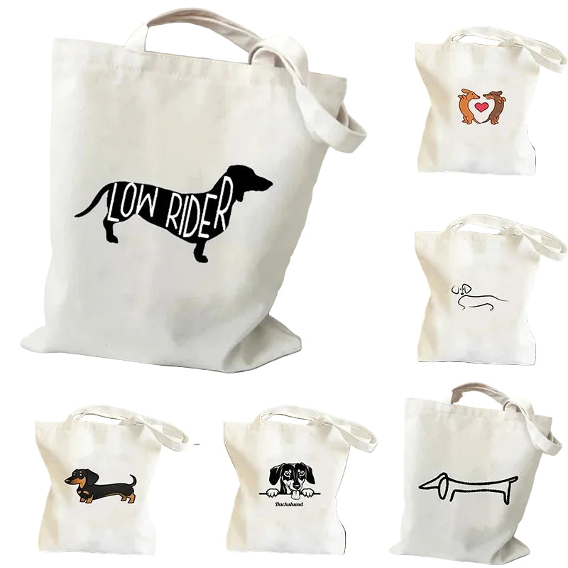 Collection of cream canvas tote bags featuring assorted Dachshund designs, including Low Rider, heart, line art and cartoon dog prints