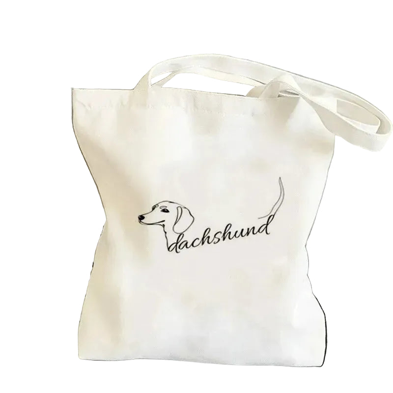 Cream canvas tote bag featuring a minimalist Dachshund line drawing with the word Dachshund in script