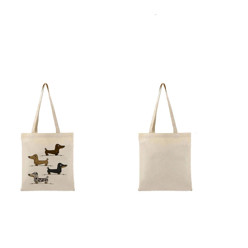 Cream canvas tote bag featuring four illustrated Dachshund dogs in different coat colours