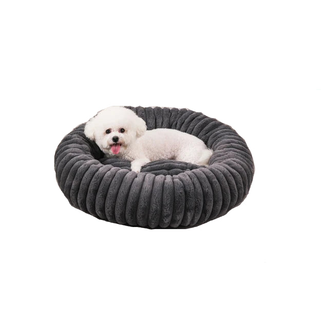 Dark grey round ribbed dog bed with raised cushioned sides, shown with a small dog and size measurement guide