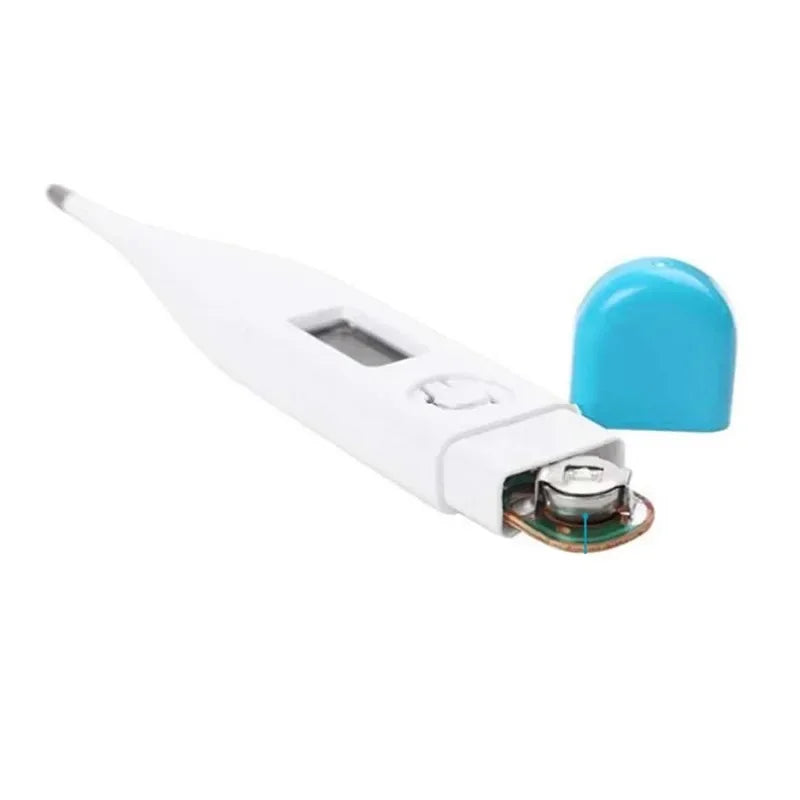 White digital pet thermometer with blue end cap removed, showing the internal battery compartment and LCD display