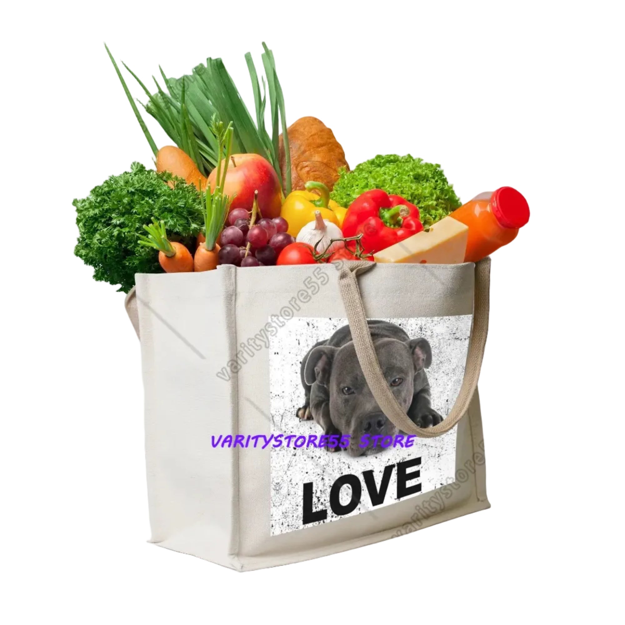Cream canvas grocery tote bag featuring a black dog portrait with the word Love, filled with fresh vegetables and groceries
