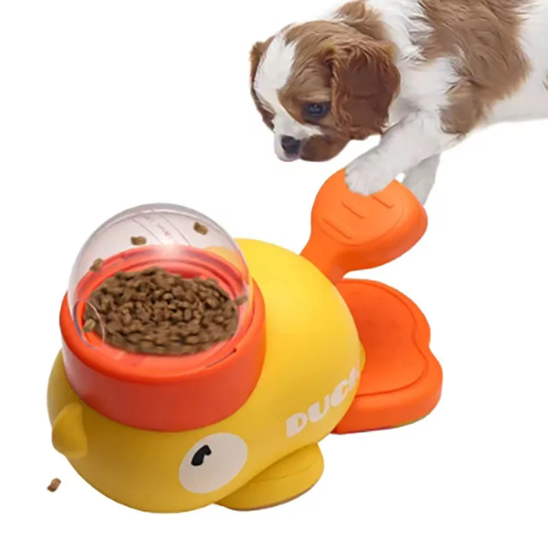 Duck-shaped dog food dispenser and slow feeder with dry kibble and paw-operated feeding lever