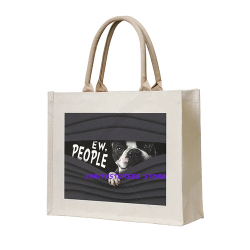Cream canvas tote bag featuring a dog peeking through a dark graphic with the phrase Ew, People