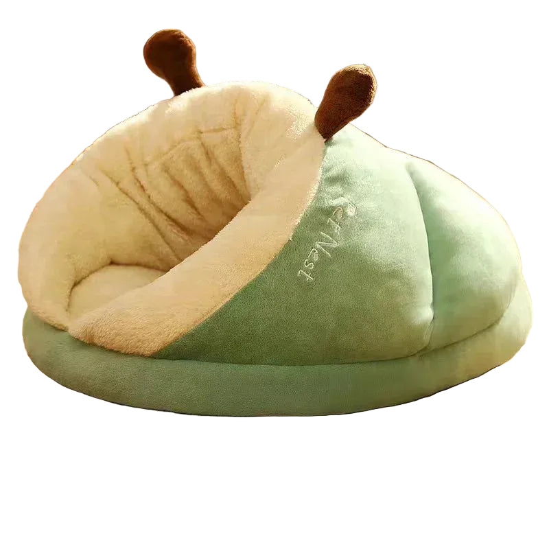 Green plush covered pet bed with soft cream lining and playful antennae design for cats and small dogs