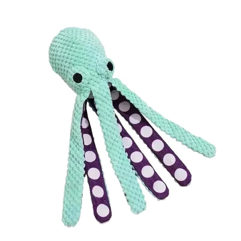 Green plush octopus dog toy with soft textured fabric and purple polka dot tentacles