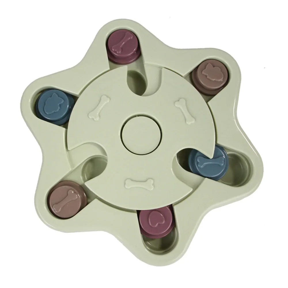Green star-shaped interactive dog puzzle feeder with sliding treat compartments and rotating centre section