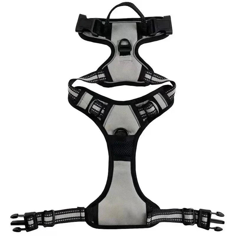 Grey and black adjustable dog harness with reflective straps, padded panels, grab handle and leash attachment rings