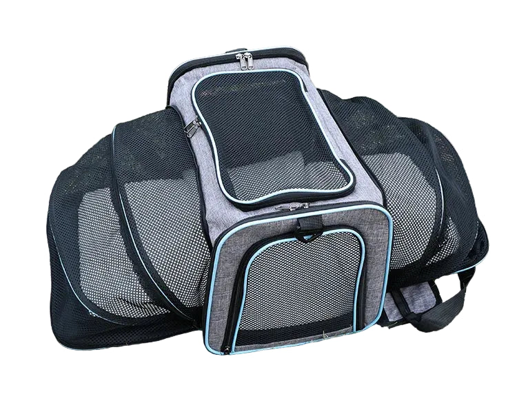 Grey expandable mesh pet carrier shown fully open with breathable side panels, zippered front and top openings