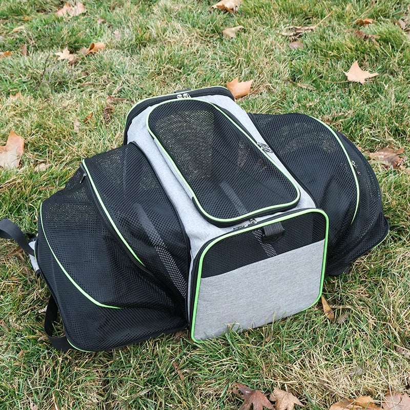 Grey expandable pet carrier bag with breathable mesh sides, zippered front opening and padded interior