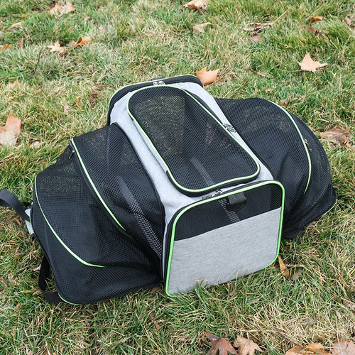 Grey expandable pet carrier bag with breathable mesh sides, zippered front opening and padded interior
