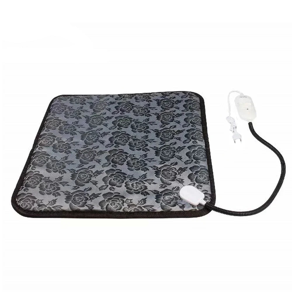 Grey electric heated pet mat with black floral pattern, power cord and temperature controller