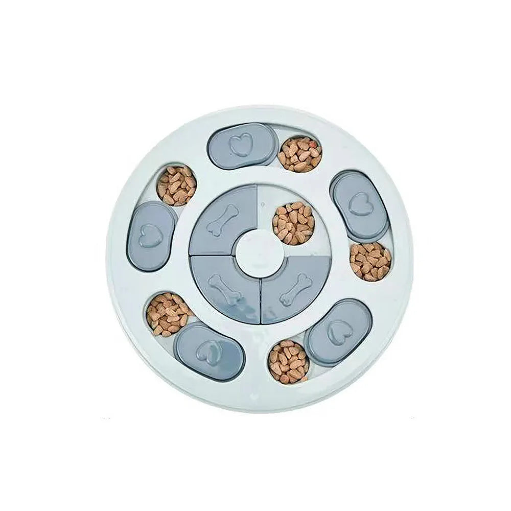 Grey interactive dog puzzle feeder with sliding treat compartments filled with dry dog food